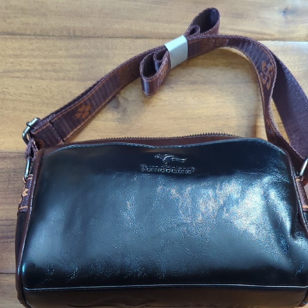 Polished Brown Leather Crossbody Bag with Branded Strap